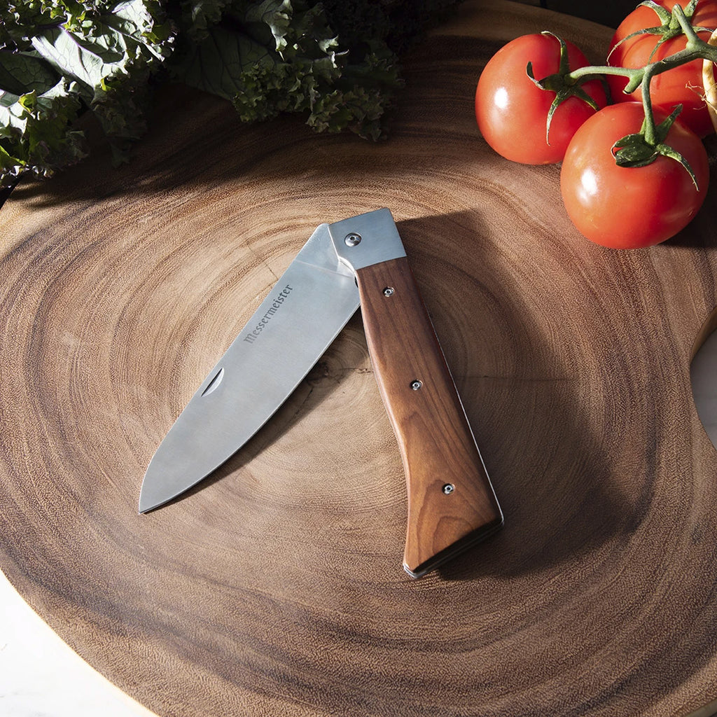 http://robidouxinc.com/cdn/shop/products/messermeister-acm-866-folding-chef-knife-adventure-series-on-wood_1024x.jpg?v=1658832155